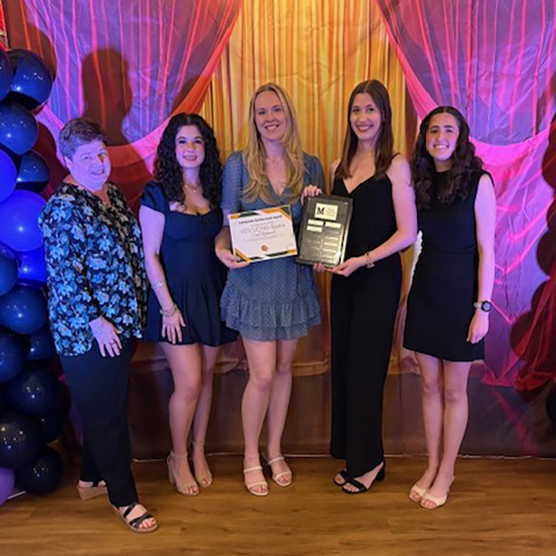 group photo of students and andrea novak